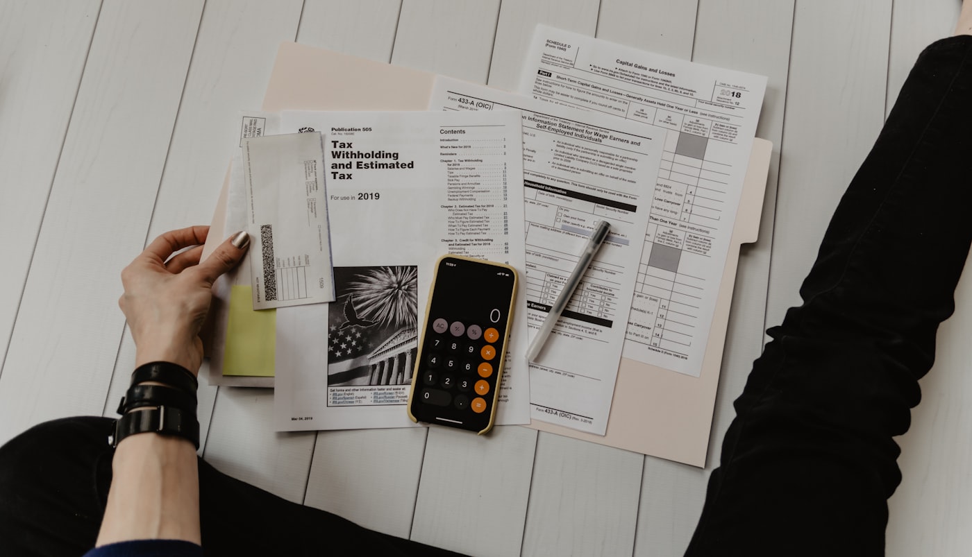 Accountant working through bookkeeping and reports on a laptop